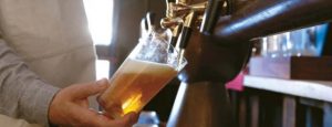 AI beer brewing showcased through craft beer glasses prepared with modern brewing techniques