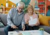 California Retirement Crisis Deepens as Costs Soar Elderly couple reviewing documents at home