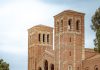 UC Admissions Reach Record High for California Freshmen a large brick building with a clock tower