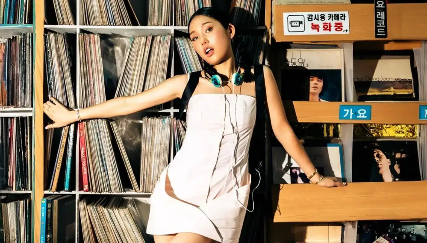 K-pop star Mimi poses in record store for solo debut photoshoot.