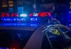 $2.5 Million Investment Fraud: Virginia Man Convicted in Scheme A police car with flashing red and blue emergency lights on a city street